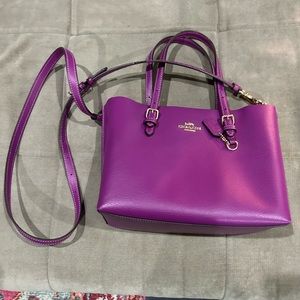Fuschia COACH handbag.